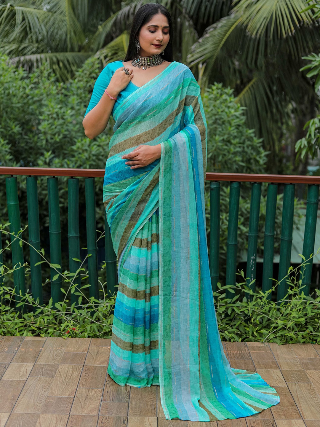 

Mitera Blue & Sea Green Striped Saree
