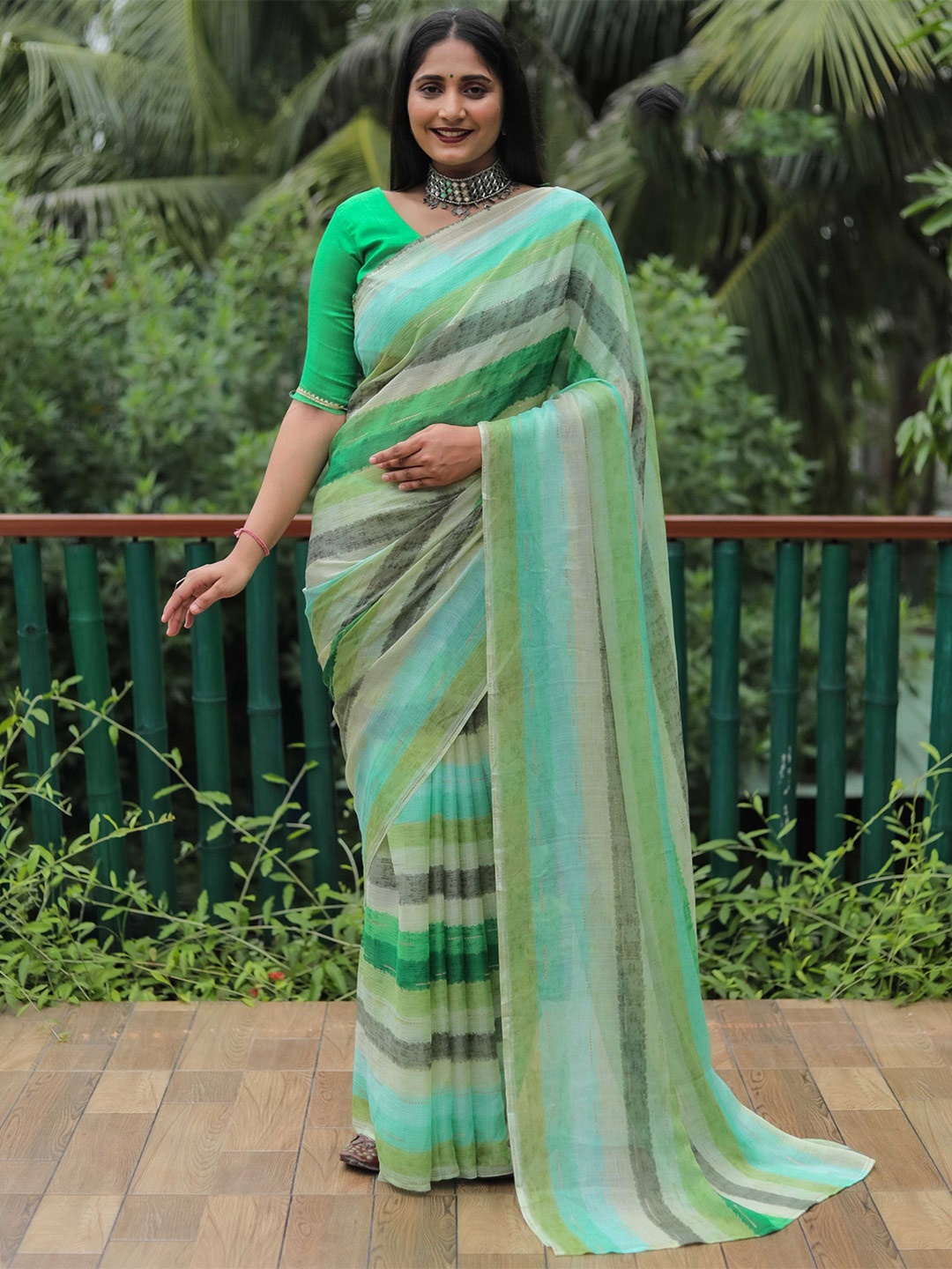 

Mitera Green Striped Saree