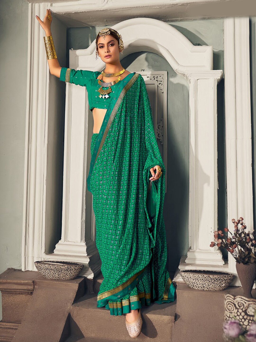 

Anouk Teal & White Ethnic Motifs Printed Embroidered Bagru Saree