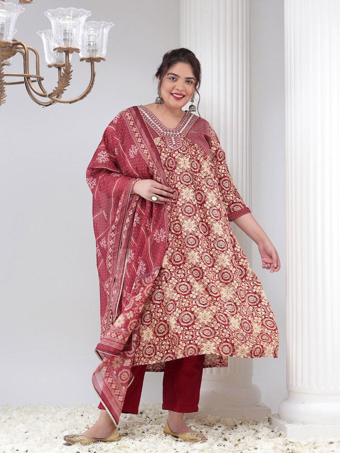 

Bani Women Plus Size Floral Printed Thread Work A-Line Kurta With Trousers & Dupatta, Maroon