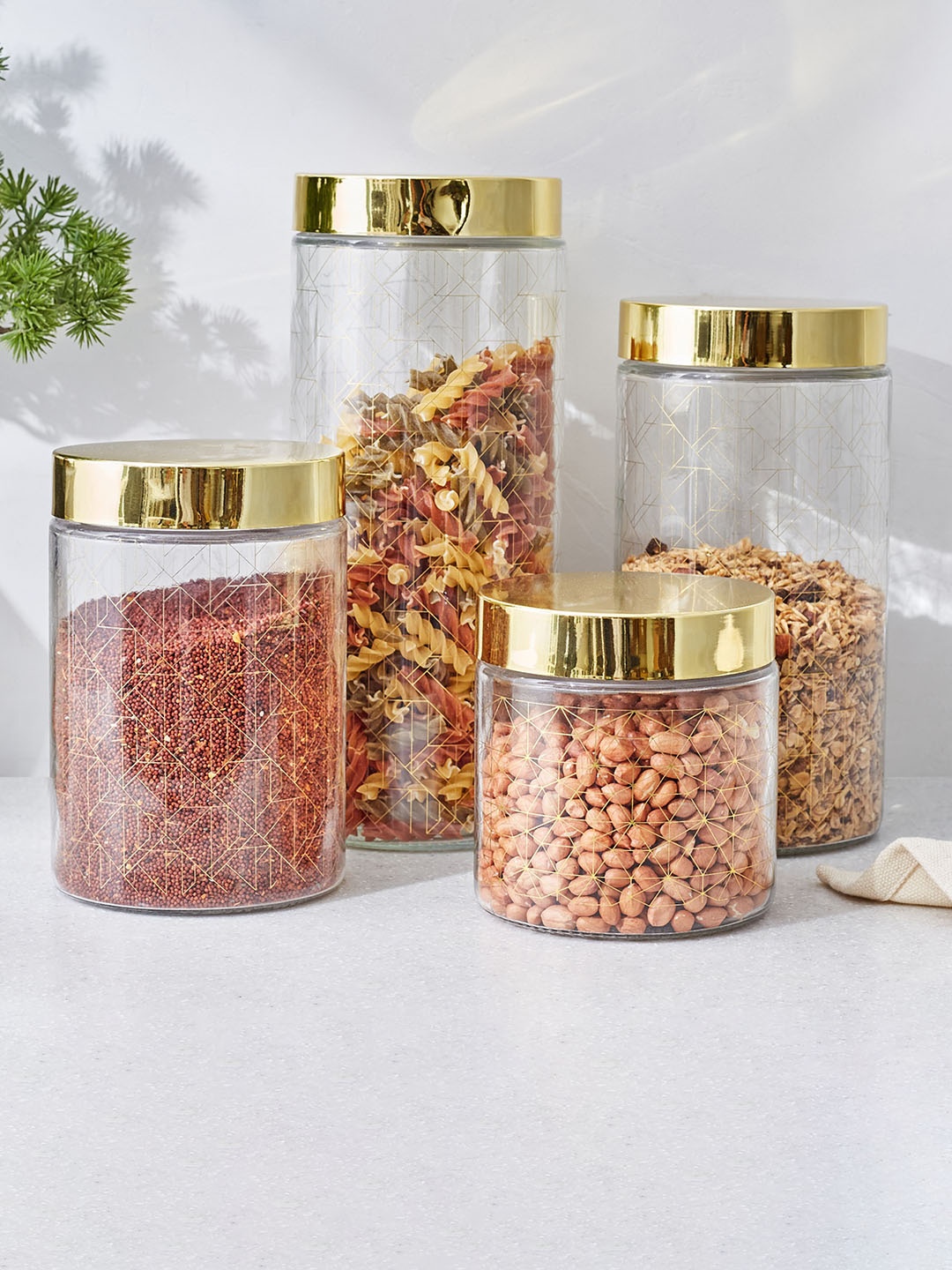 

Home Centre Travis Golden & Transparent 4 Pieces Airtight Glass Canisters, Gold