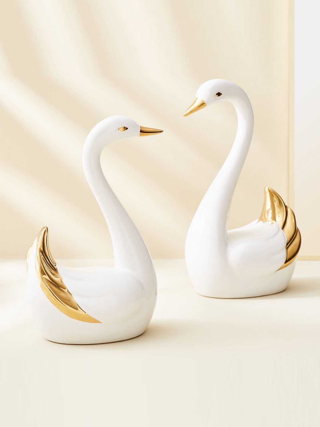

Home Centre Magnus White & Gold-Toned 2 Pieces Swan Figurine Showpiece