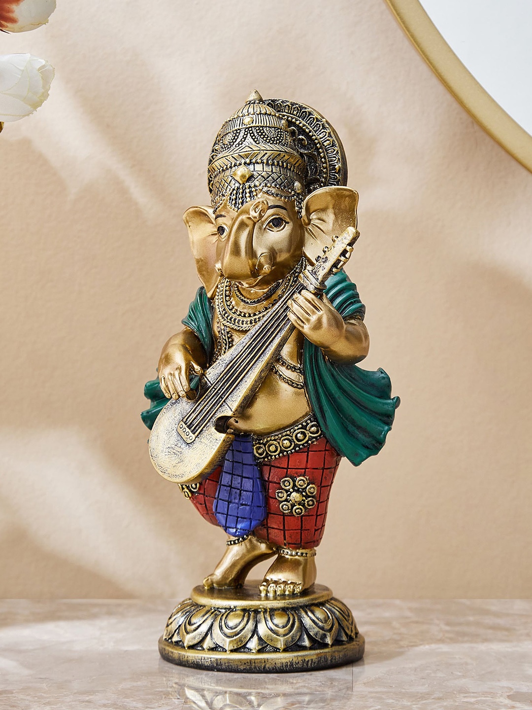 

Home Centre Alpana Gold-Toned & Red Lord Ganesha With Dholak Figurine Showpiece