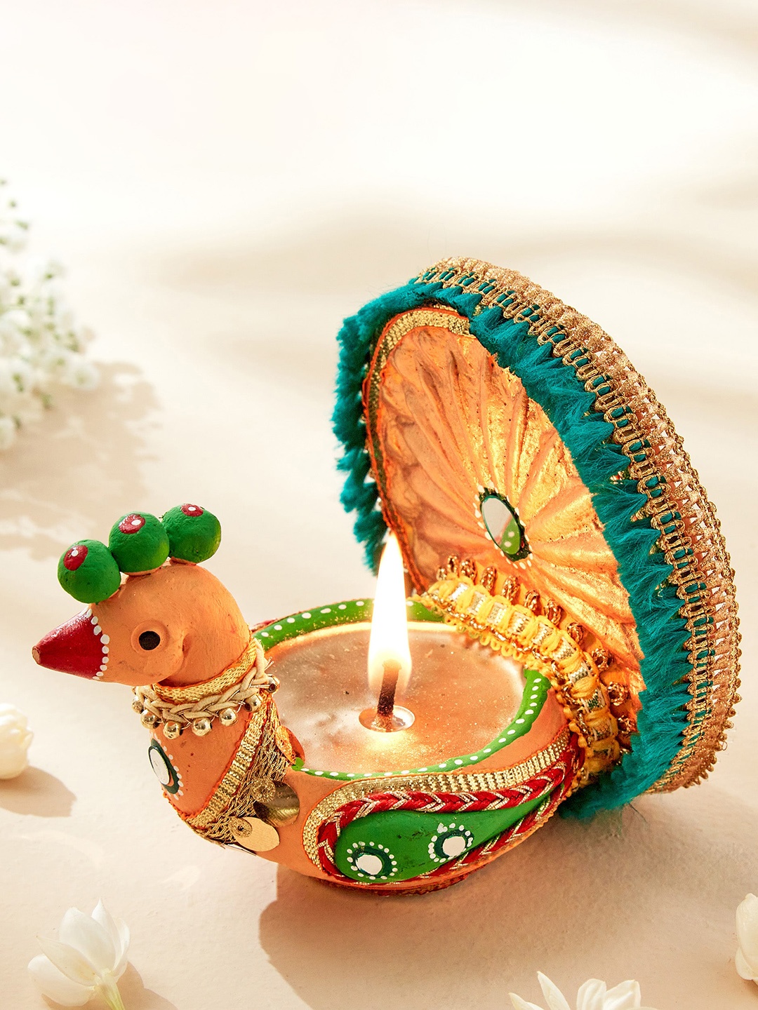 

Home Centre Utsav Beige & Green Terracotta Peacock Diya Candle