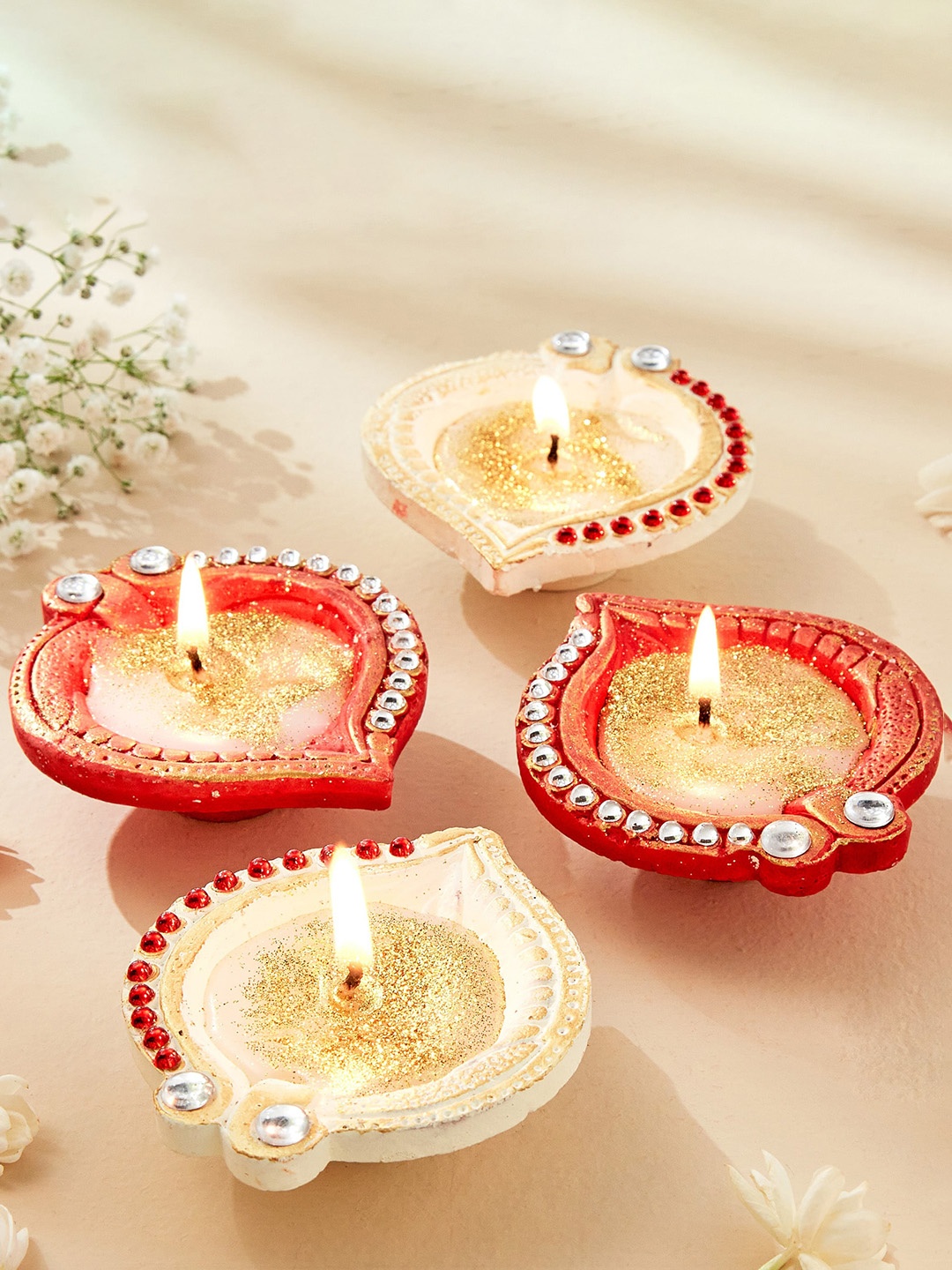 

Home Centre Utsav Red & White 4 Pieces Earthen Clay Leaf Diya Candles