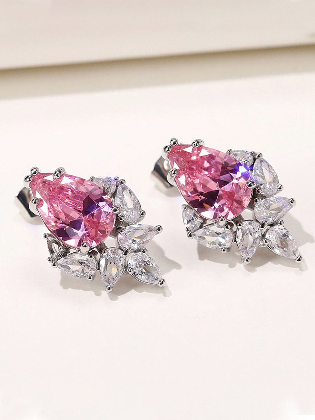 

Jewels Galaxy Silver-Plated Teardrop Shaped Studs Earrings