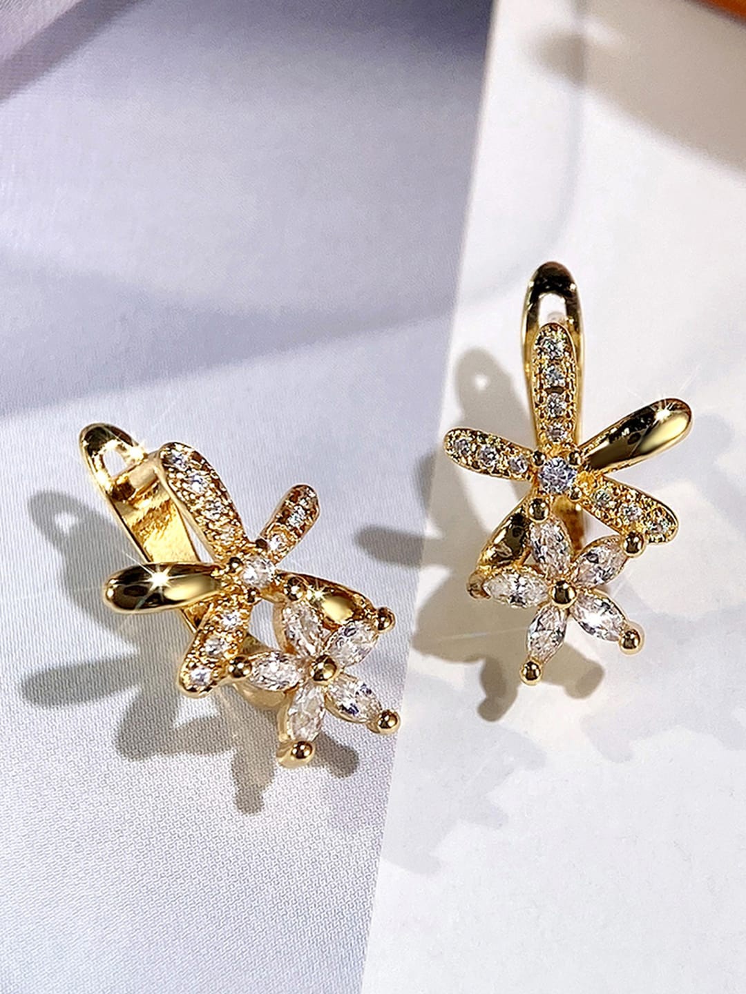 

Jewels Galaxy Gold-Plated Star Shaped Studs Earrings