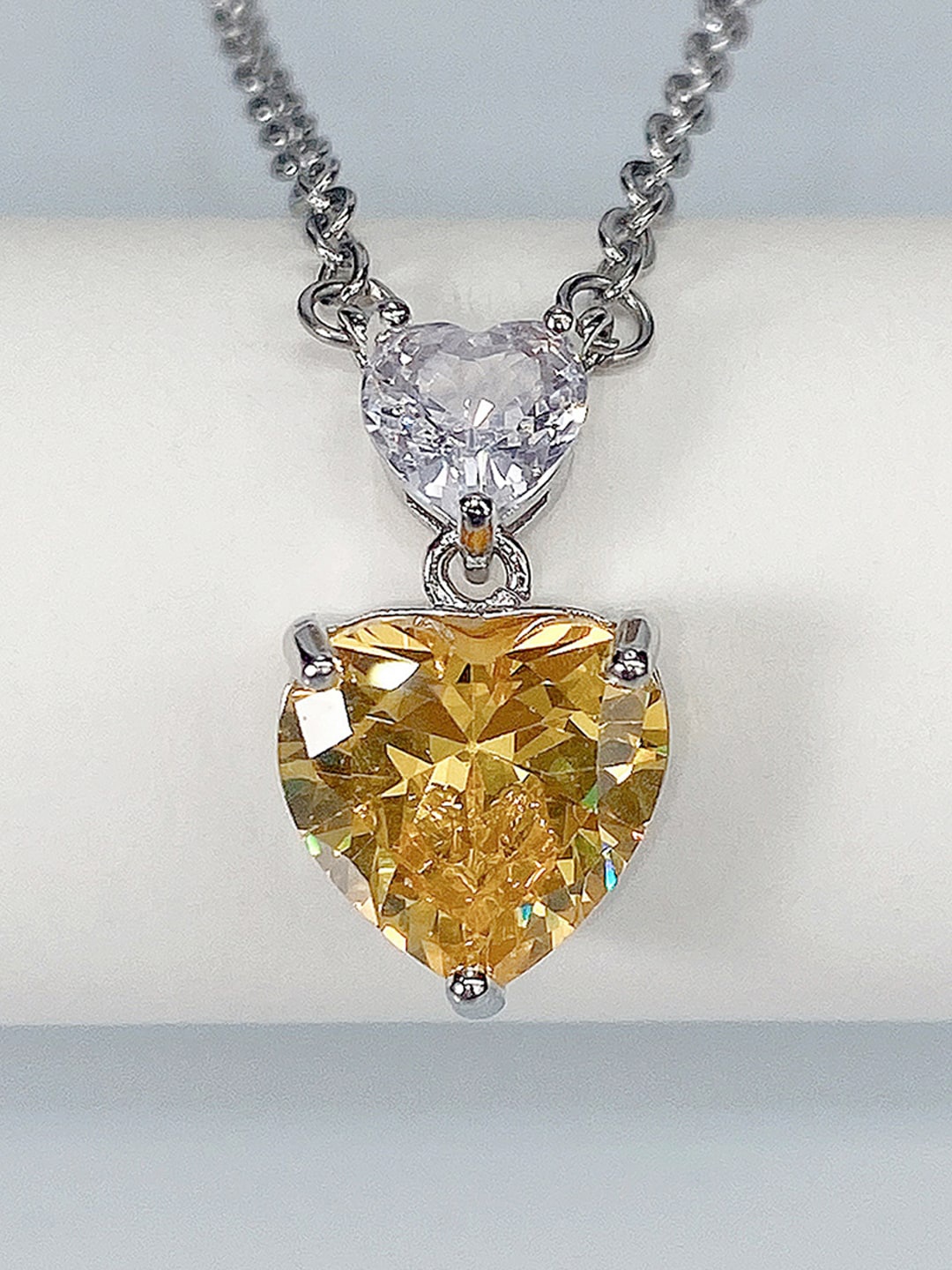 

Jewels Galaxy Silver-Plated AD-Studded Pendant With Chain