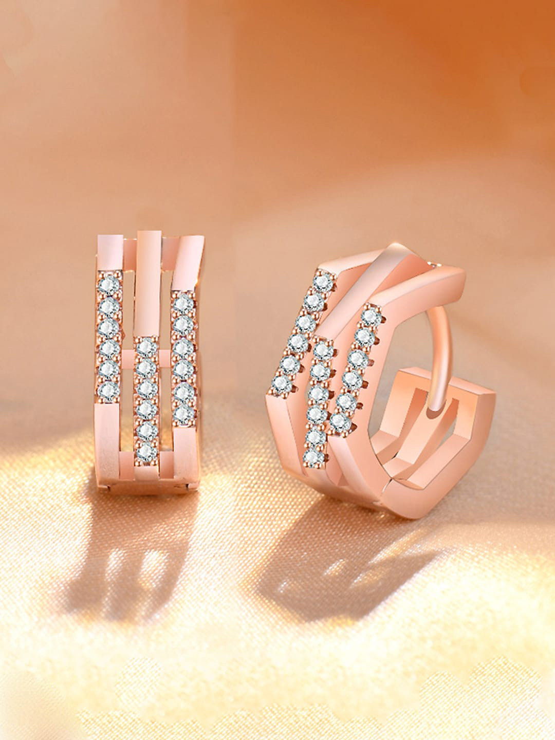 

Jewels Galaxy Rose Gold Plated American Diamond Studded Contemporary Hoop Earrings