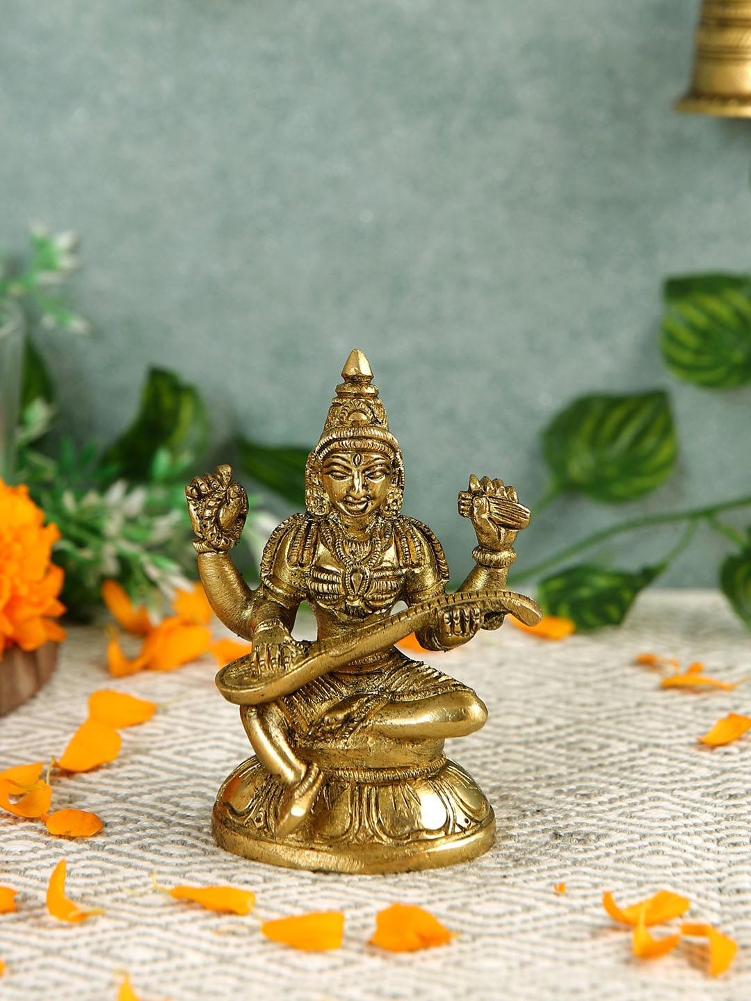 

Imli Street Yellow Textured Saraswathi Idol Figurine Showpiece