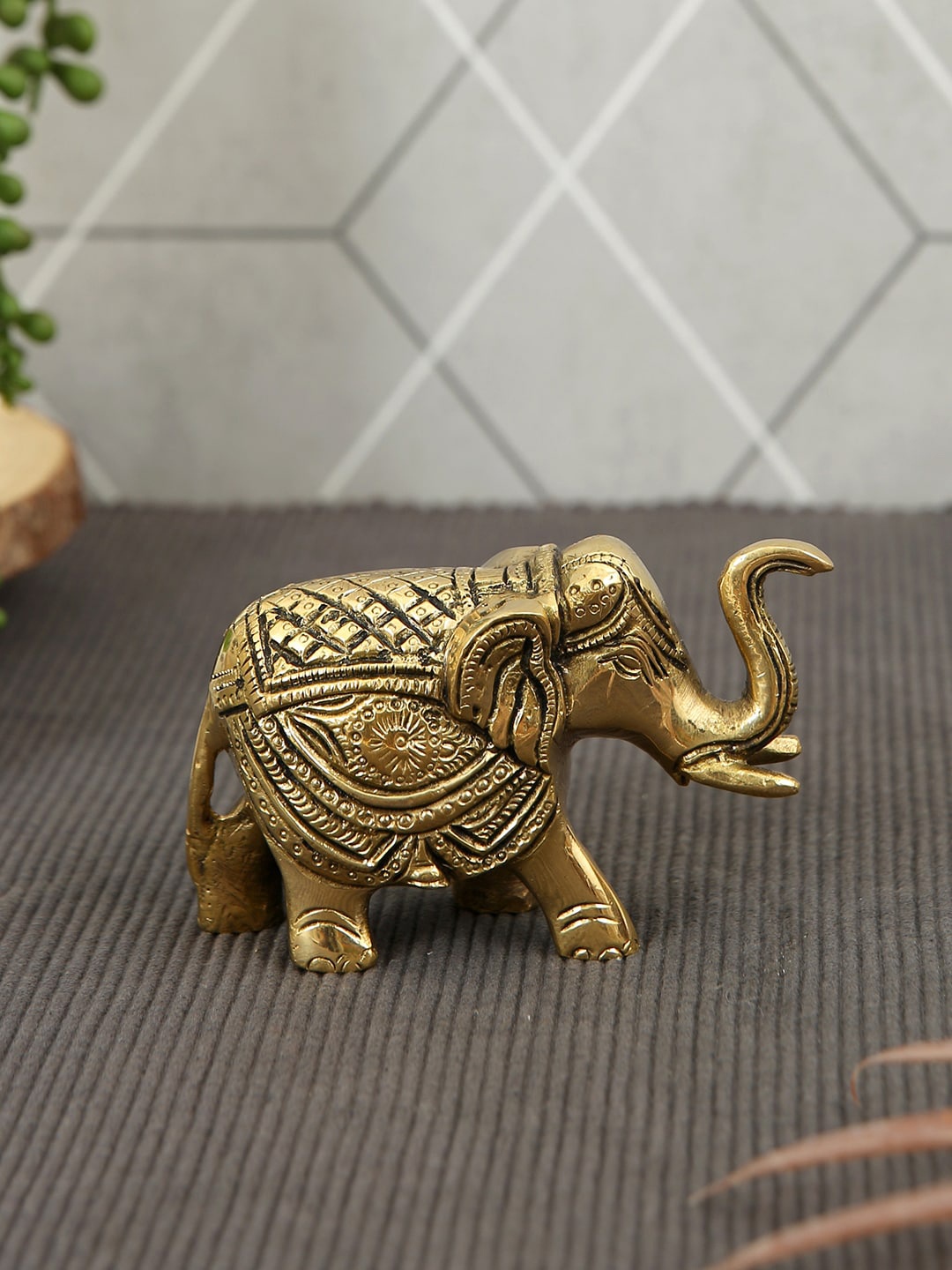 

Imli Street Gold Toned Elephant Ring Carved Table Top Brass Showpiece
