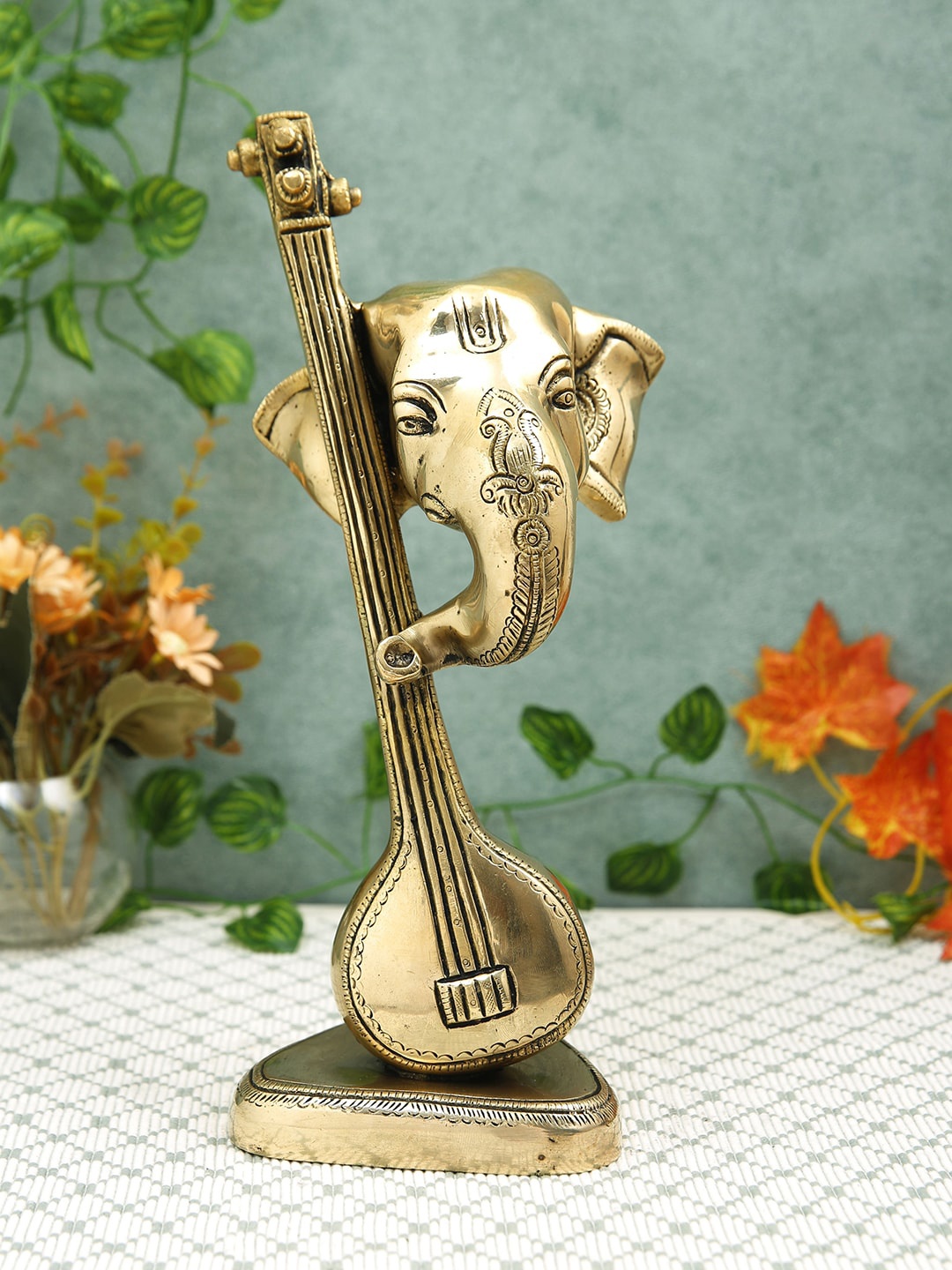 

Imli Street Gold Toned Sitar Ganesh Table Top Idol Showpiece