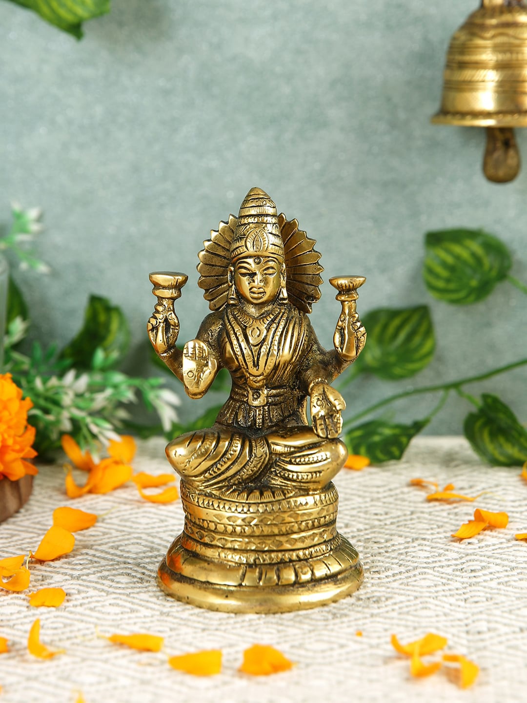 

Imli Street Gold Toned Textured Laxmi Sitting Brass Idol Showpiece