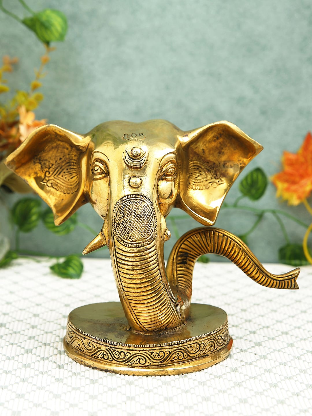 

Imli Street Golden Textured Ganesh Face Table Top Brass Idol Showpiece, Gold