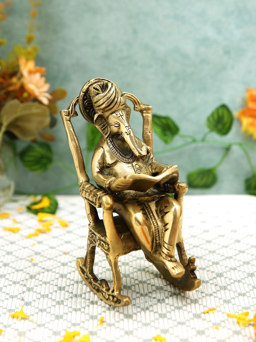 

Imli Street Gold Toned Textured Ganesha On Rocking Chair & Reading Ramayan Idol Showpiece