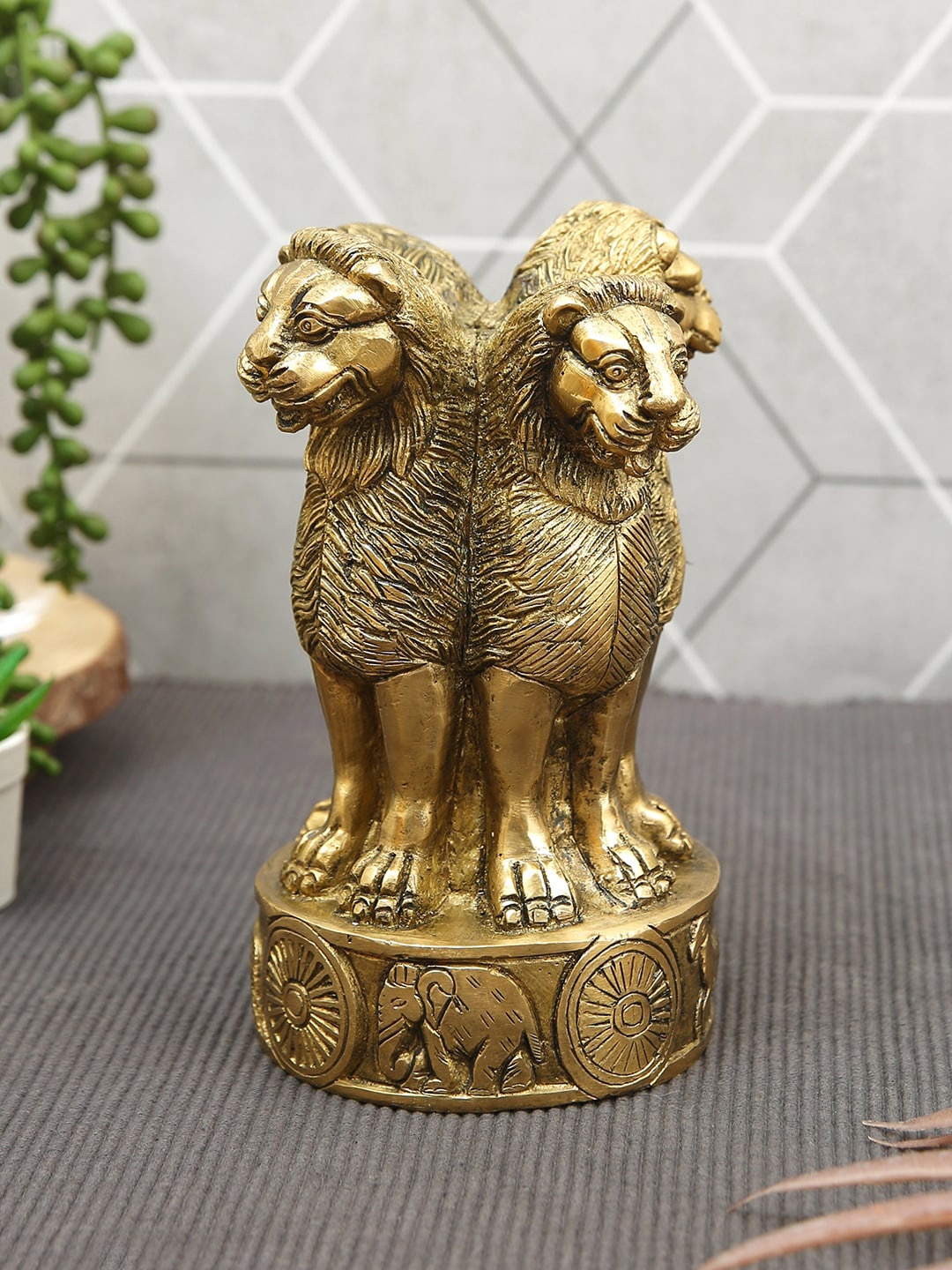 

Imli Street Gold toned Textured Ashoka Pillar Brass Figurine Showpiece