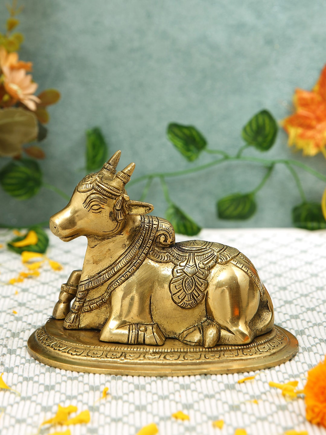 

Imli Street Gold Toned Nandi Sitting Brass Showpiece