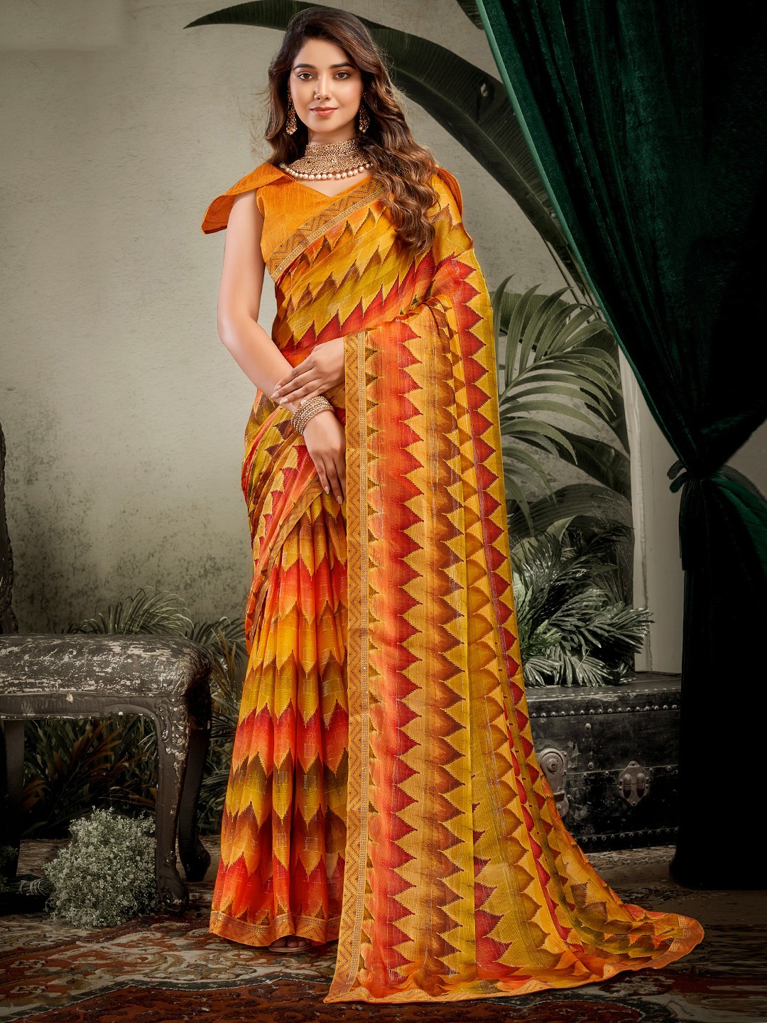 

SANSKAR Yellow & Orange Ethnic Motifs Ikat Saree