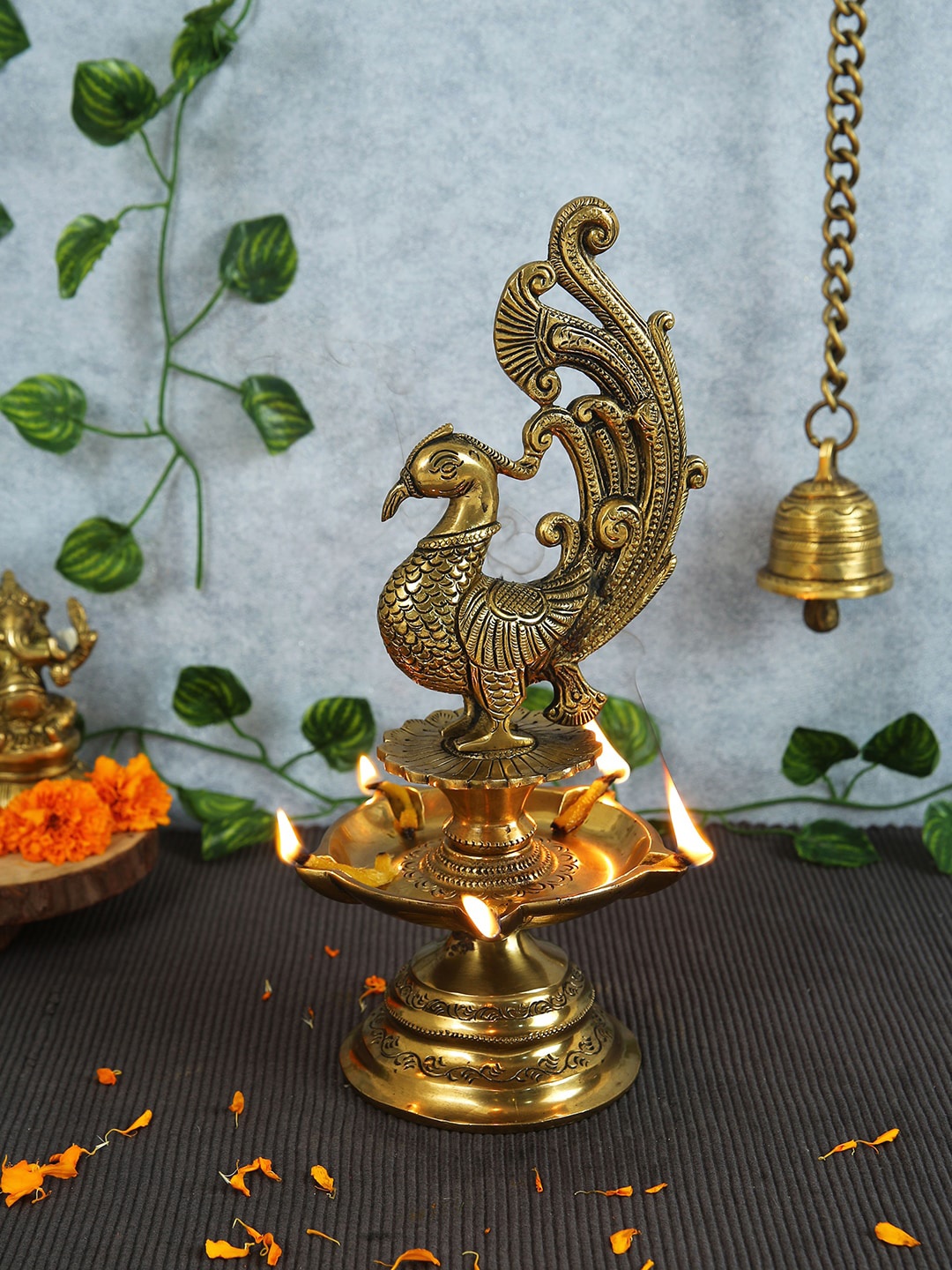 

Imli Street Gold-Toned Peacock Designed Brass Diya Lamp