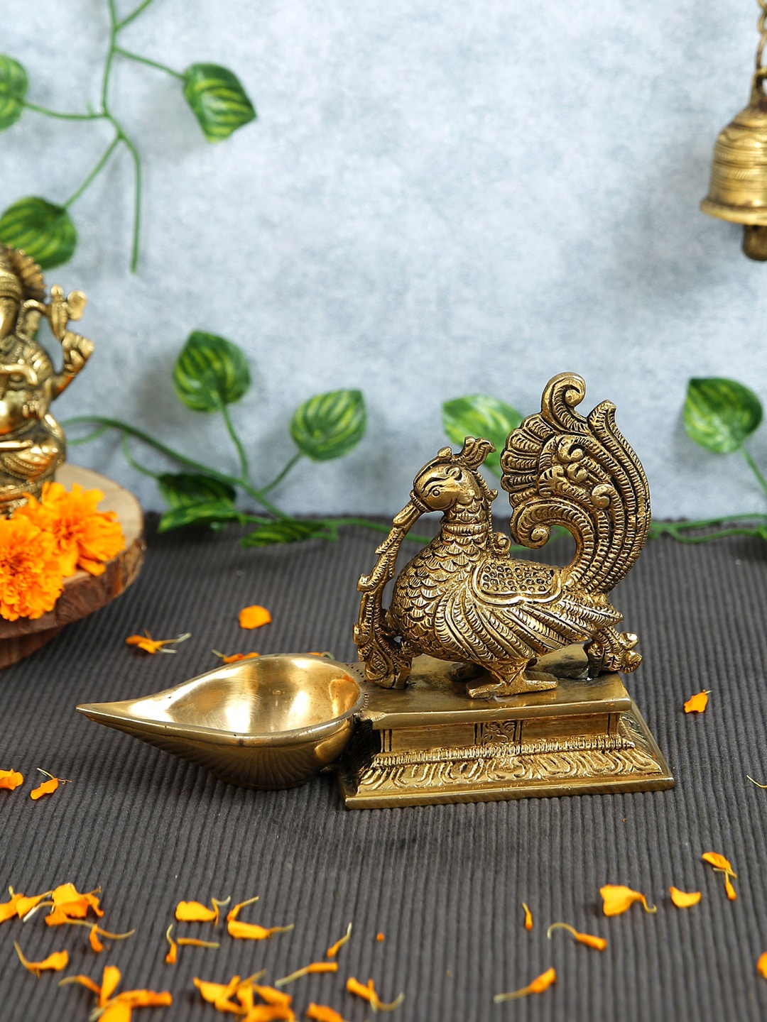 

Imli Street Gold Toned Peacock Designed Brass Diya