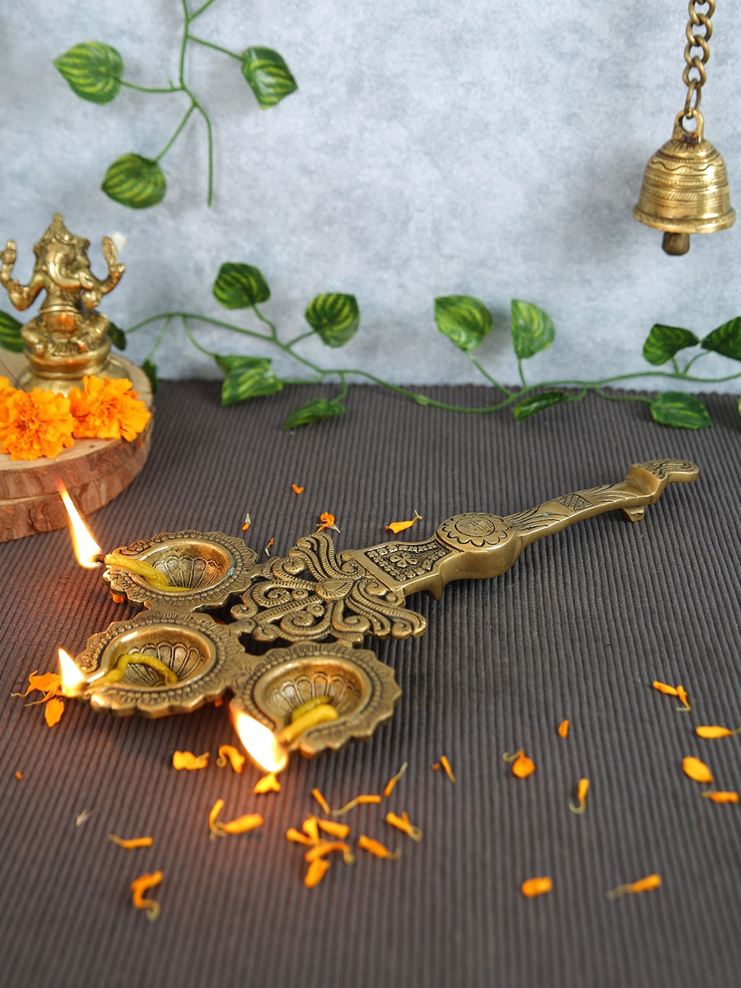 

Imli Street Gold Toned Textured Brass Big Pooja Spoon 3 Diyas