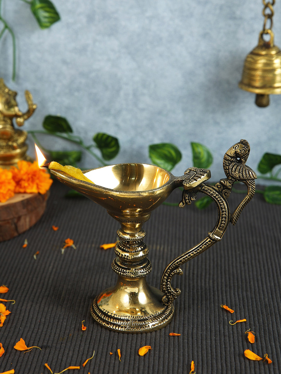 

Imli Street Gold Toned Peacock Designed Brass Diya Lamp With Handle