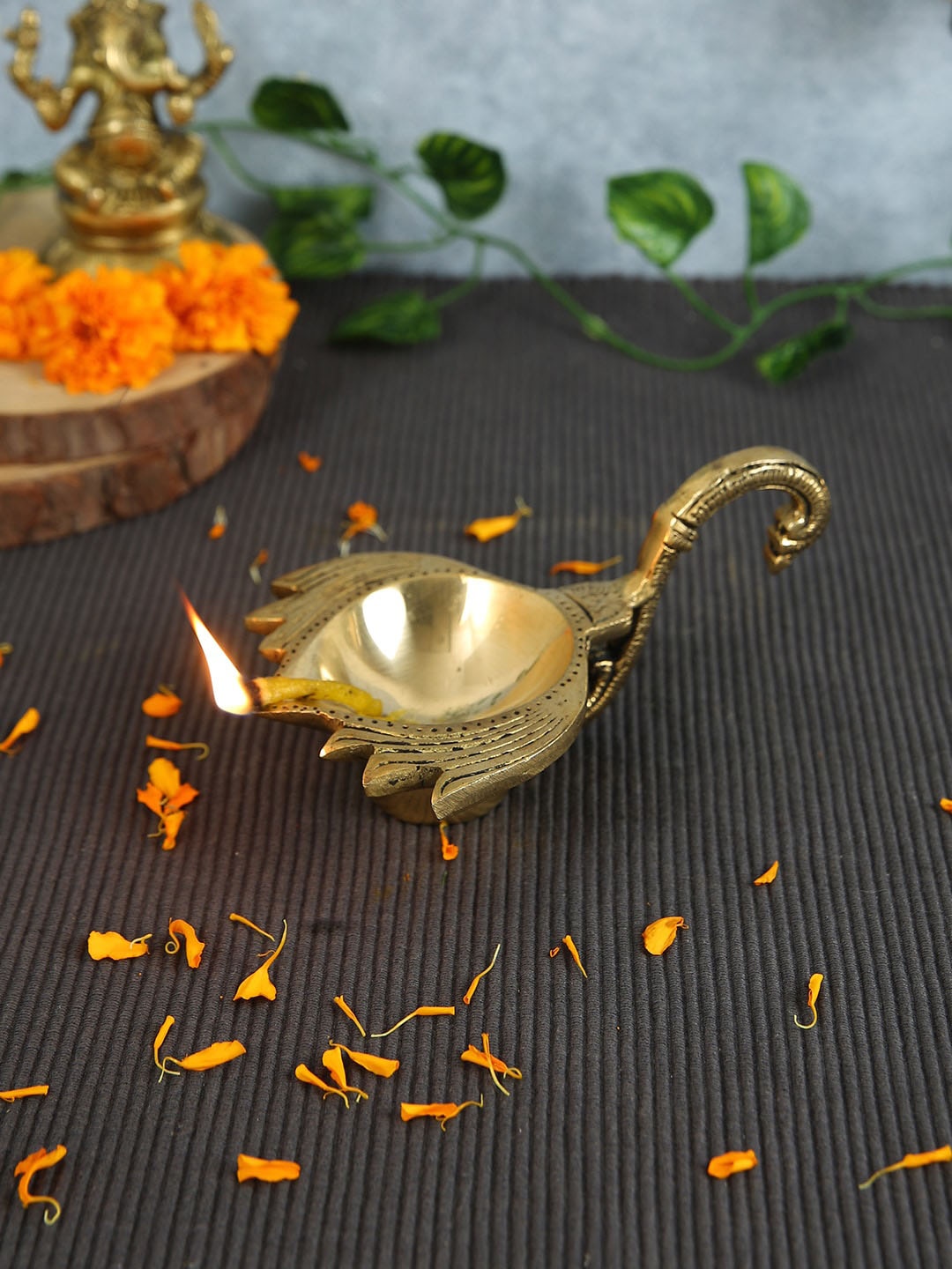 

Imli Street Gold Toned Lotus Designed Brass Diya With Handle