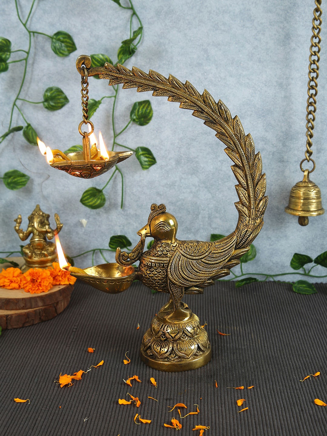 

Imli Street Gold Toned Peacock Designed Brass Diya Lamp