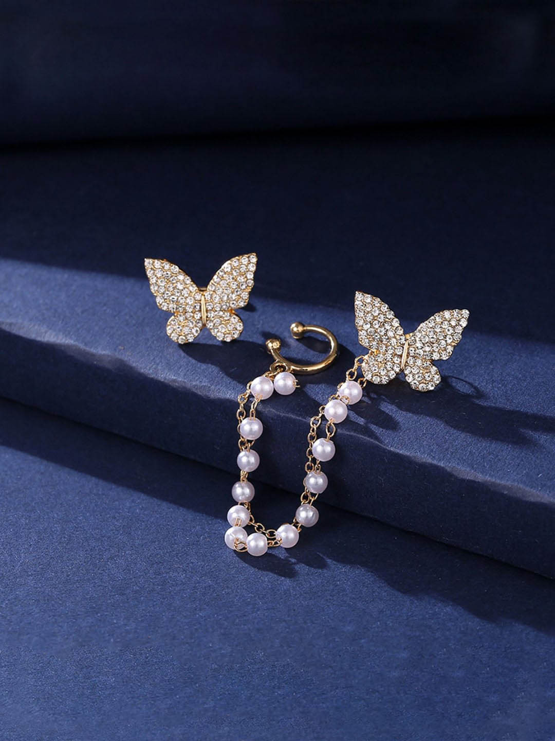 

VAGHBHATT Gold Plated Butterfly Stone Studded Earring With Beaded Chain & Ear Cuff