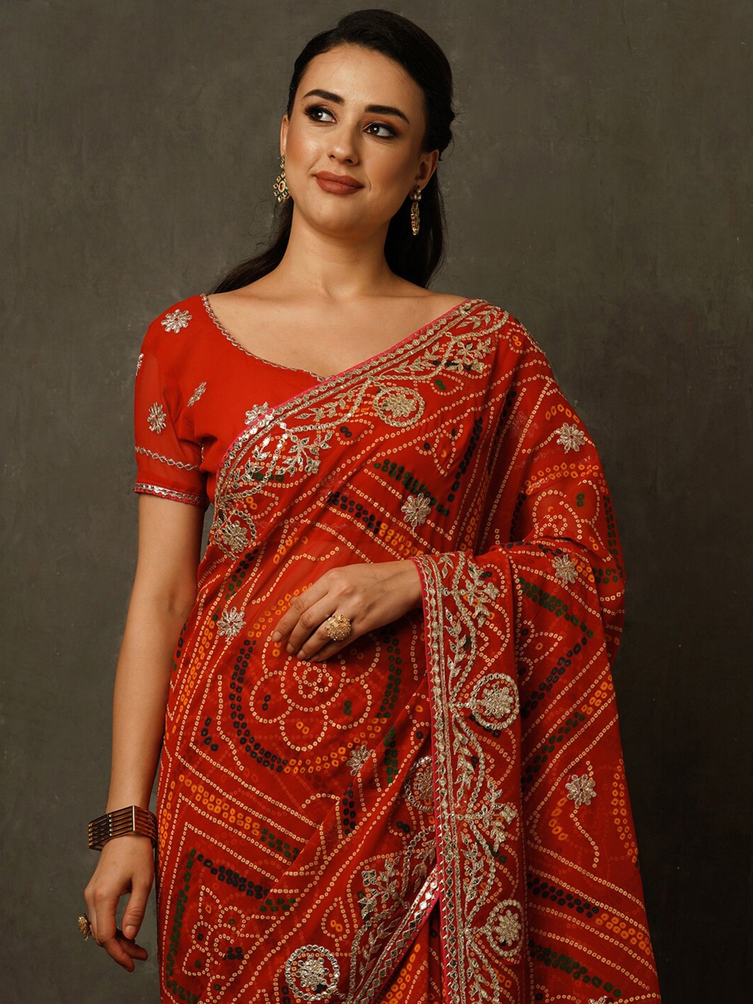 

Mitera Red & Green Bandhani Printed Embroidered Pure Georgette Saree
