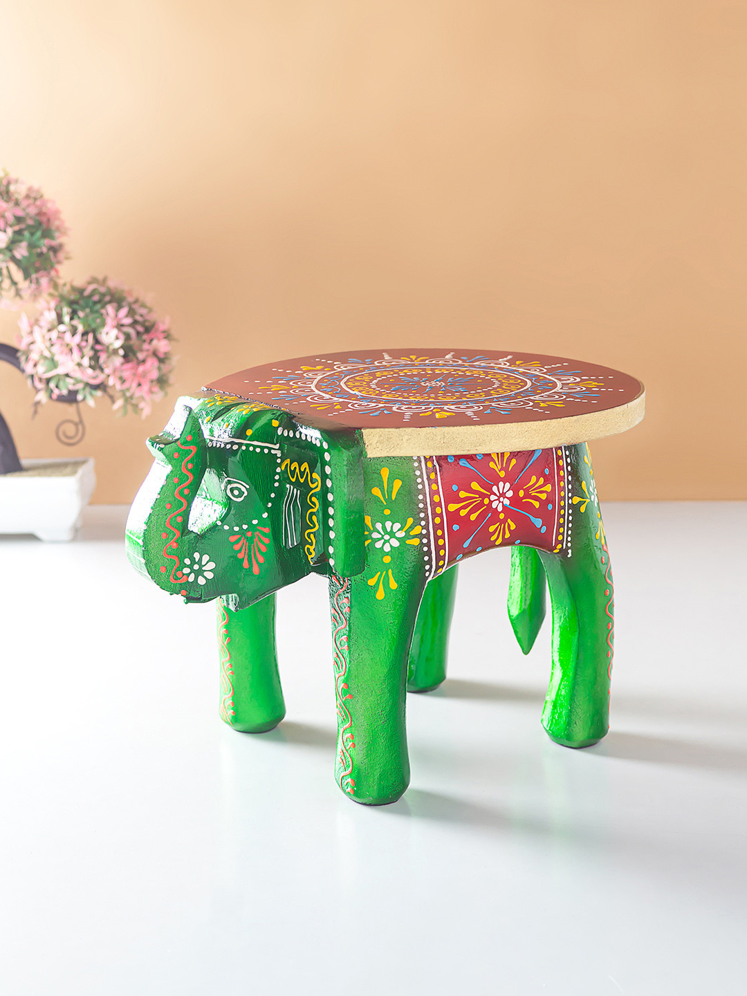 

Golden Peacock Green & Red Elephant Stool Showpiece