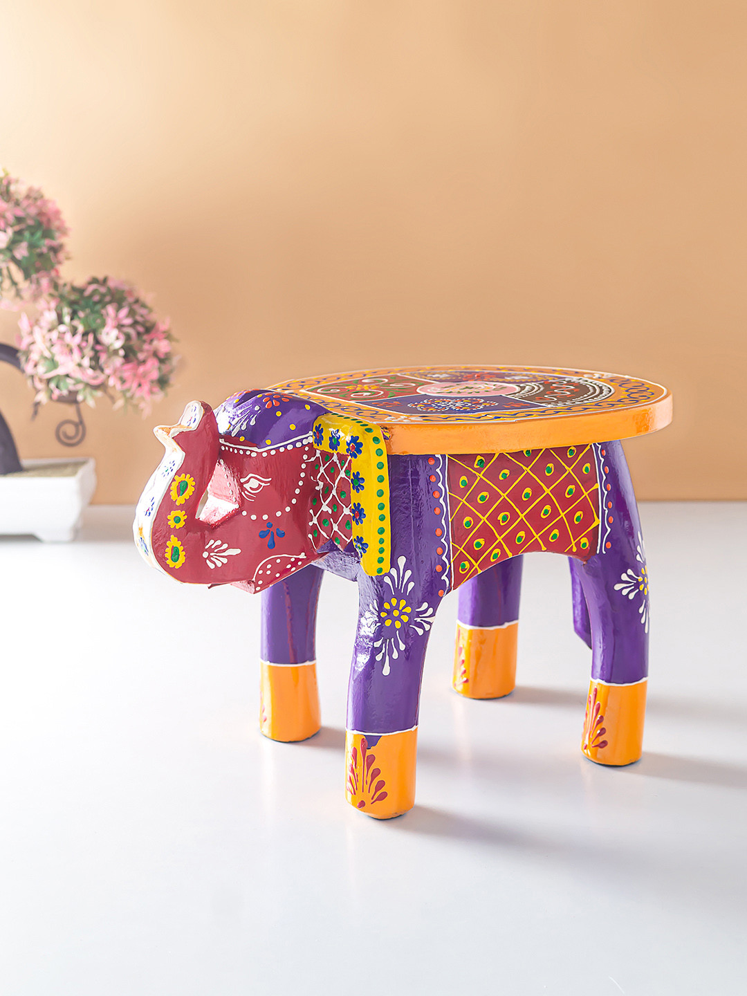 

Golden Peacock Purple & Yellow Elephant Stool Showpiece