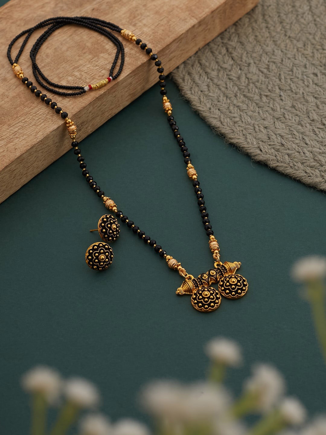 

ATIBELLE Gold Plated Floral & Circular Shaped Dhokia Style Mangalsutra With Earrings