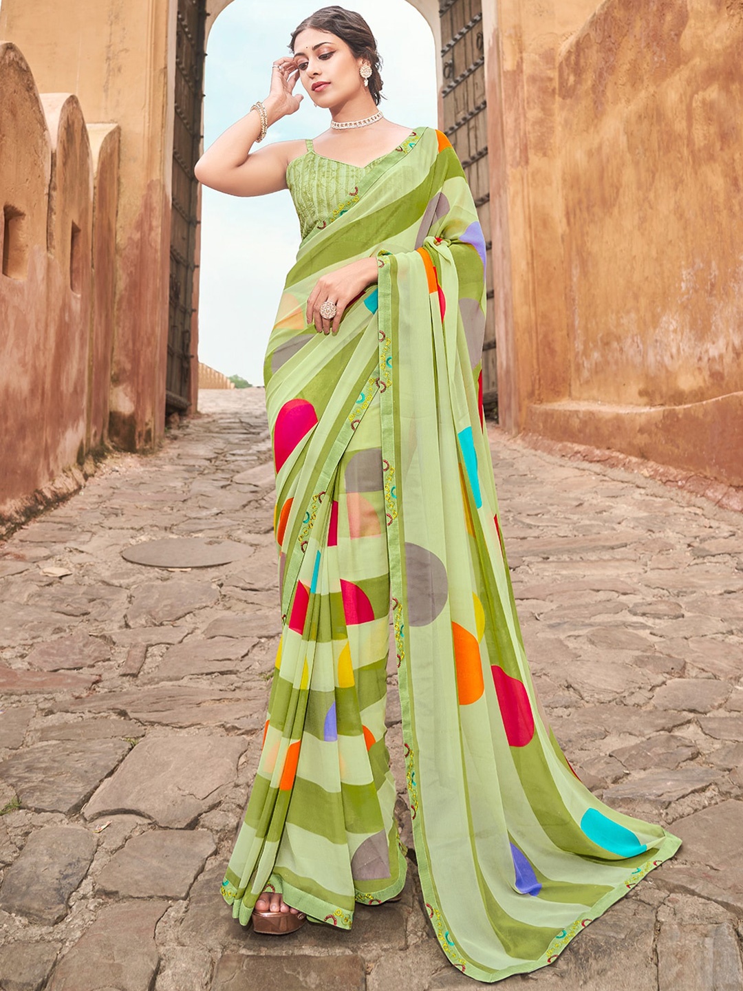 

SANSKAR Green & Orange Striped Poly Georgette Saree