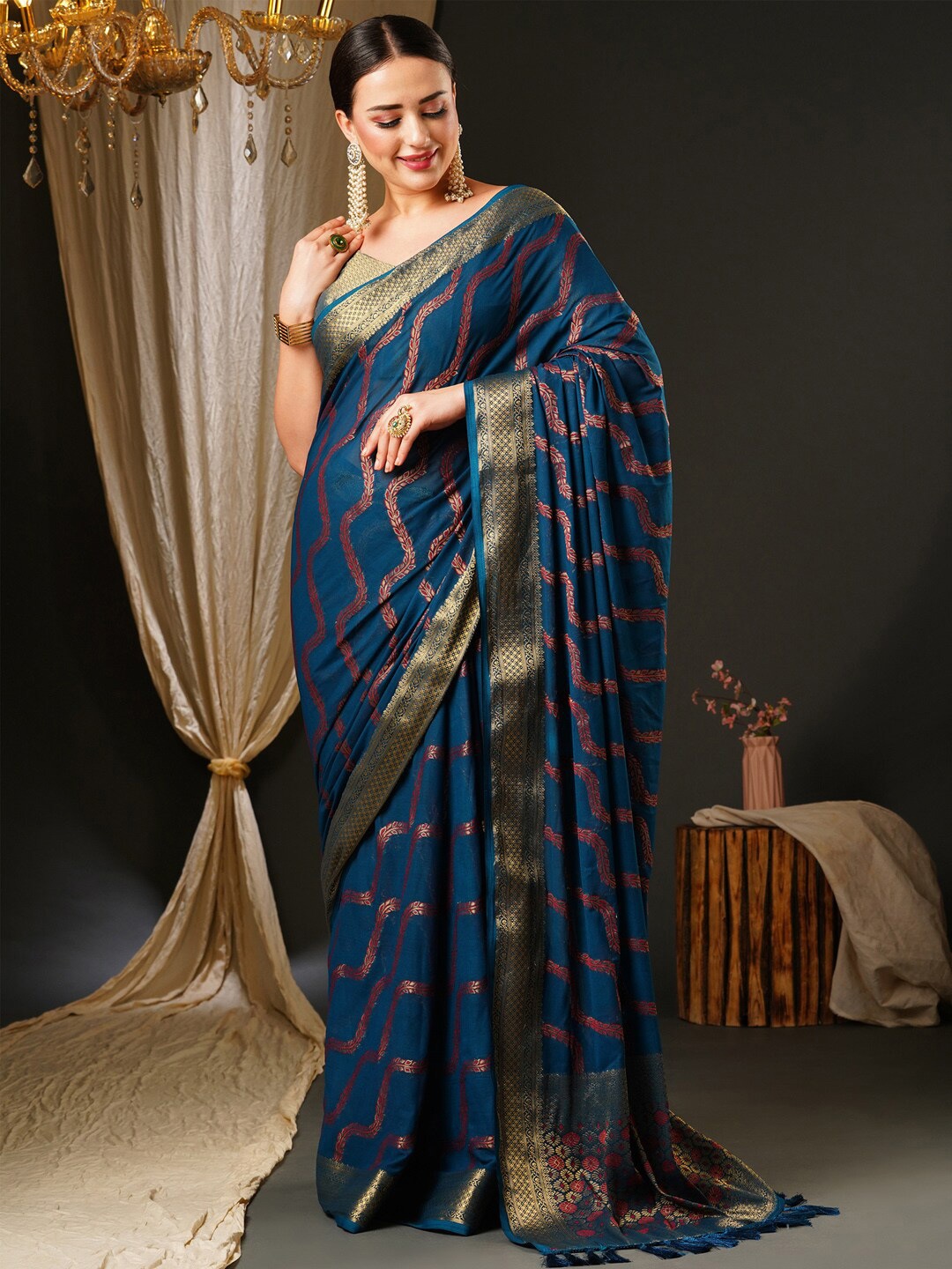 

Anouk Blue & Red Ethnic Motifs Zari Pure Georgette Kanjeevaram Saree