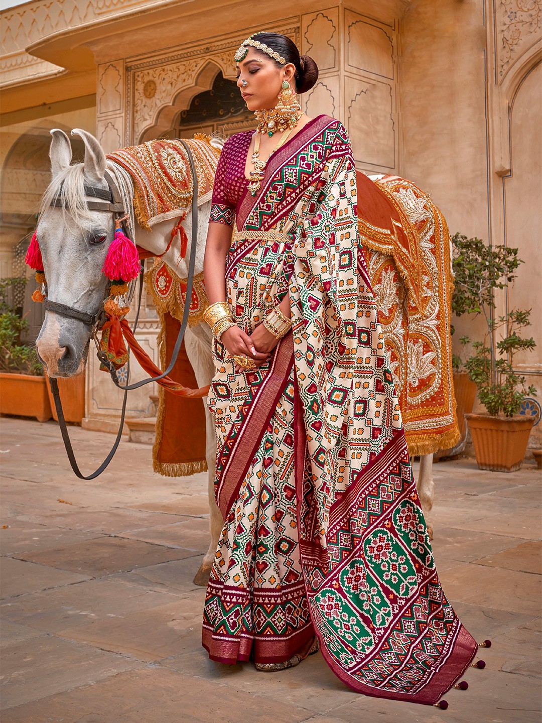 

Mitera Cream-Coloured & Maroon Zari Silk Blend Patola Saree