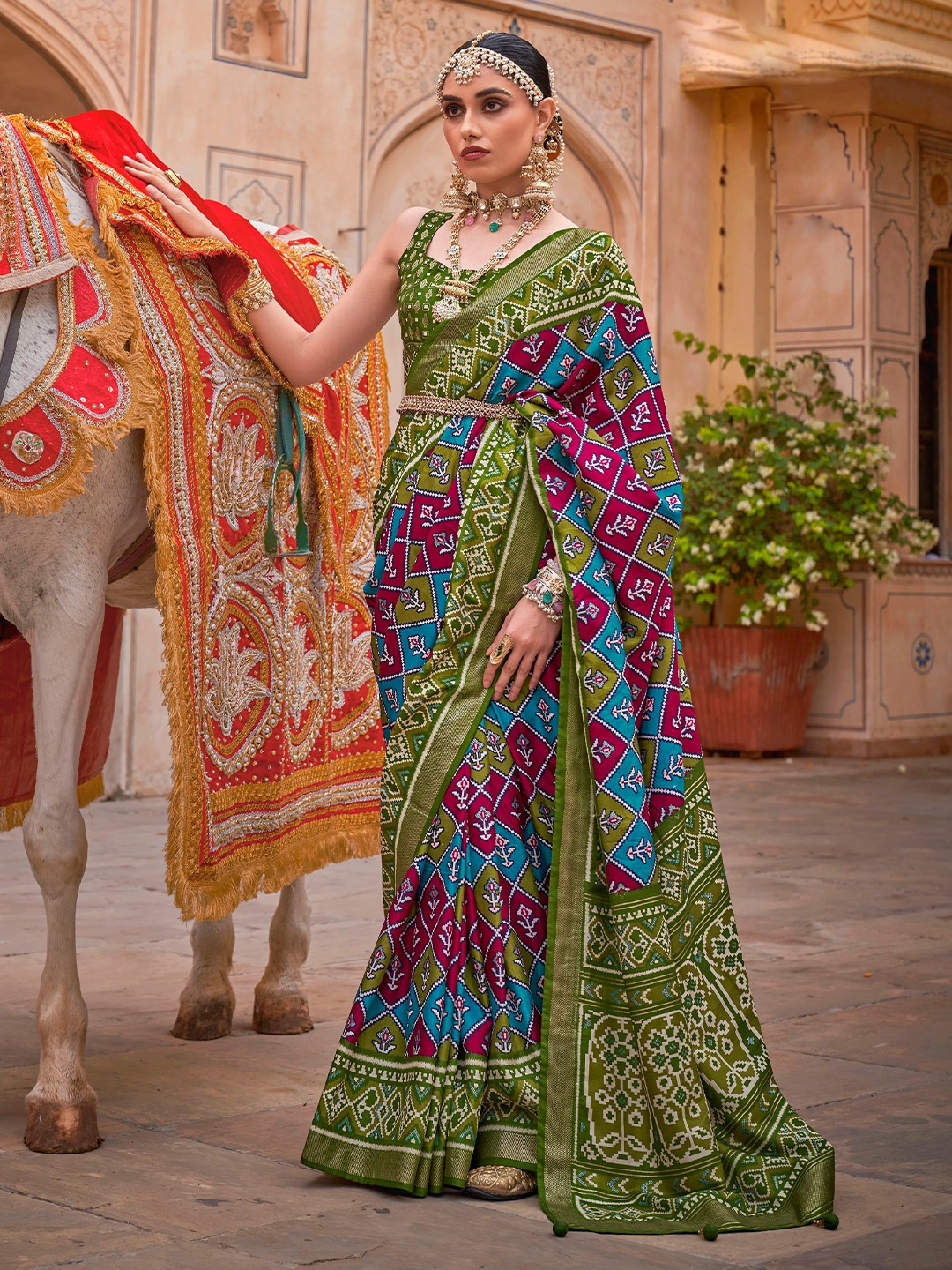 

Mitera Green & Blue Ethnic Motifs Silk Blend Patola Saree