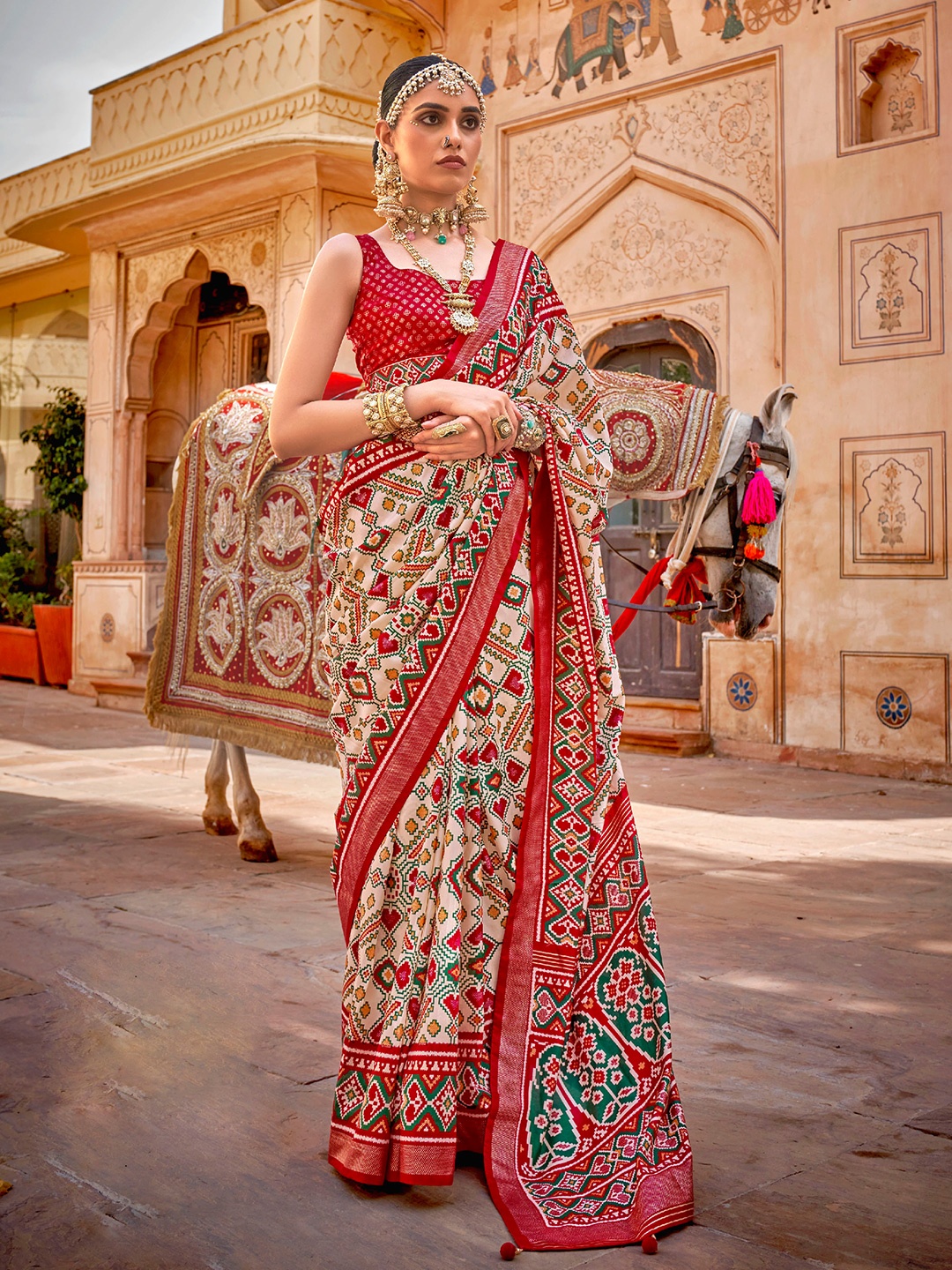 

Mitera Cream-Coloured & Red Ethnic Motifs Zari Silk Blend Patola Saree