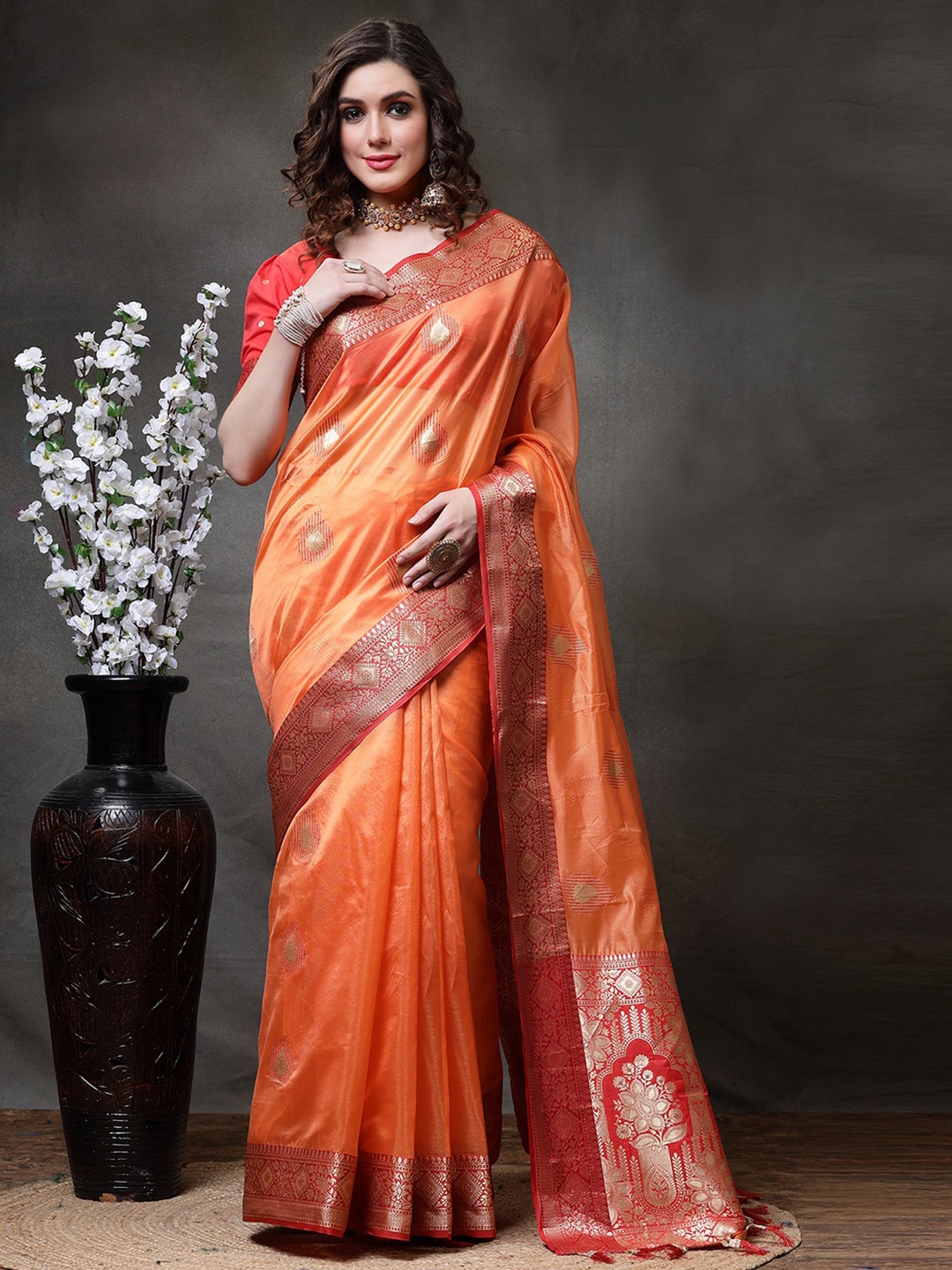 

Satrani Orange & Gold-Toned Ethic Motif Woven Design Zari Tissue Banarasi Saree