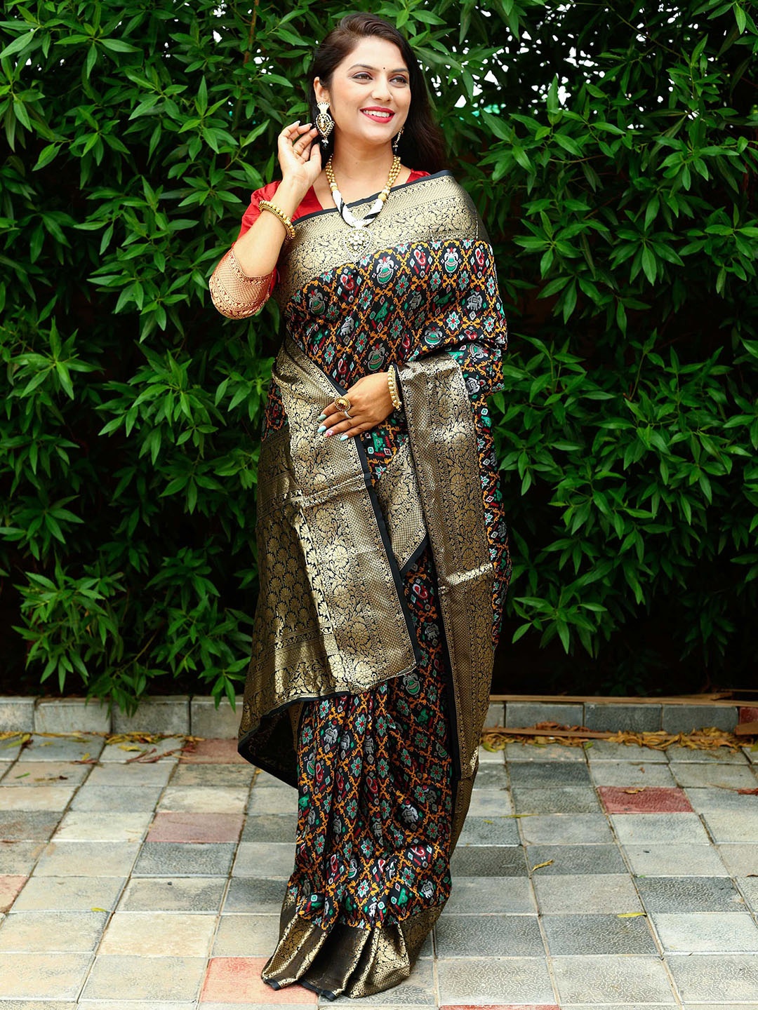 

Mitera Black & Red Woven Design Zari Patola Saree