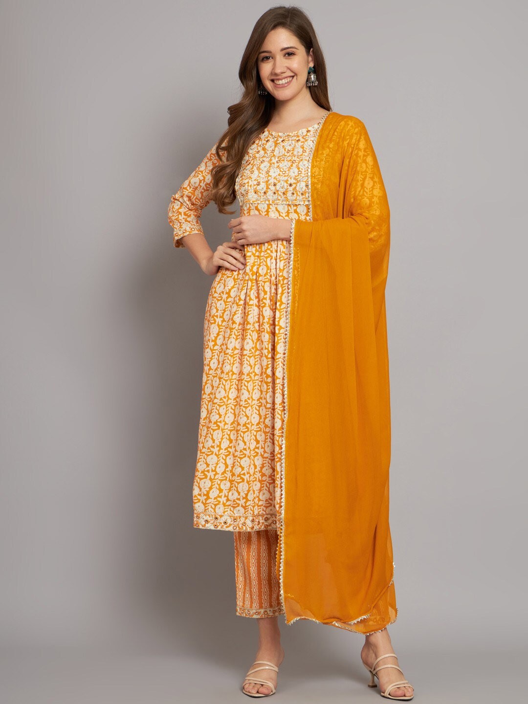 

Miramaar Floral Printed Regular Mirror Work Kurta With Trousers & Dupatta, Mustard