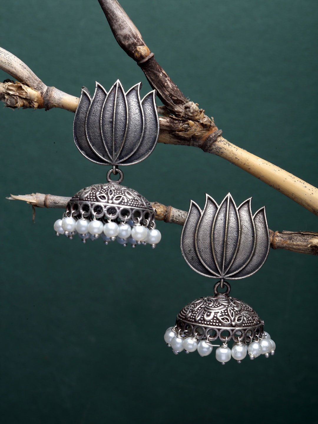 

Sanjog Silver-Plated Oxidised Lotus Design Jhumka Earrings