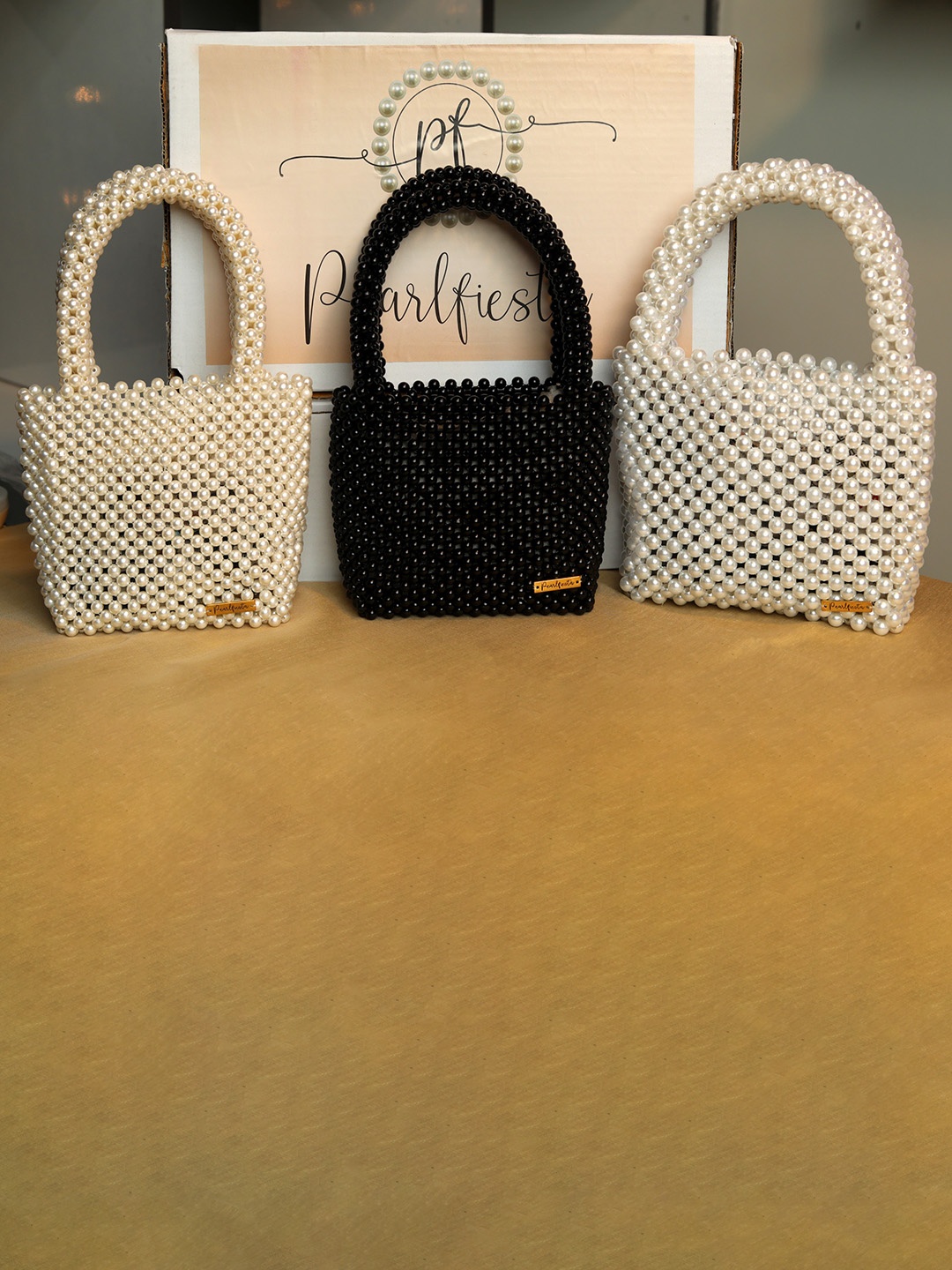 

Pearlfiesta Cream-Coloured Embellished Bucket Shoulder Bag with Cut Work