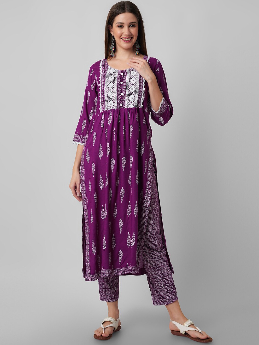 

Amayra Women Ethnic Motifs Printed Regular Thread Work Kurta with Trousers, Purple