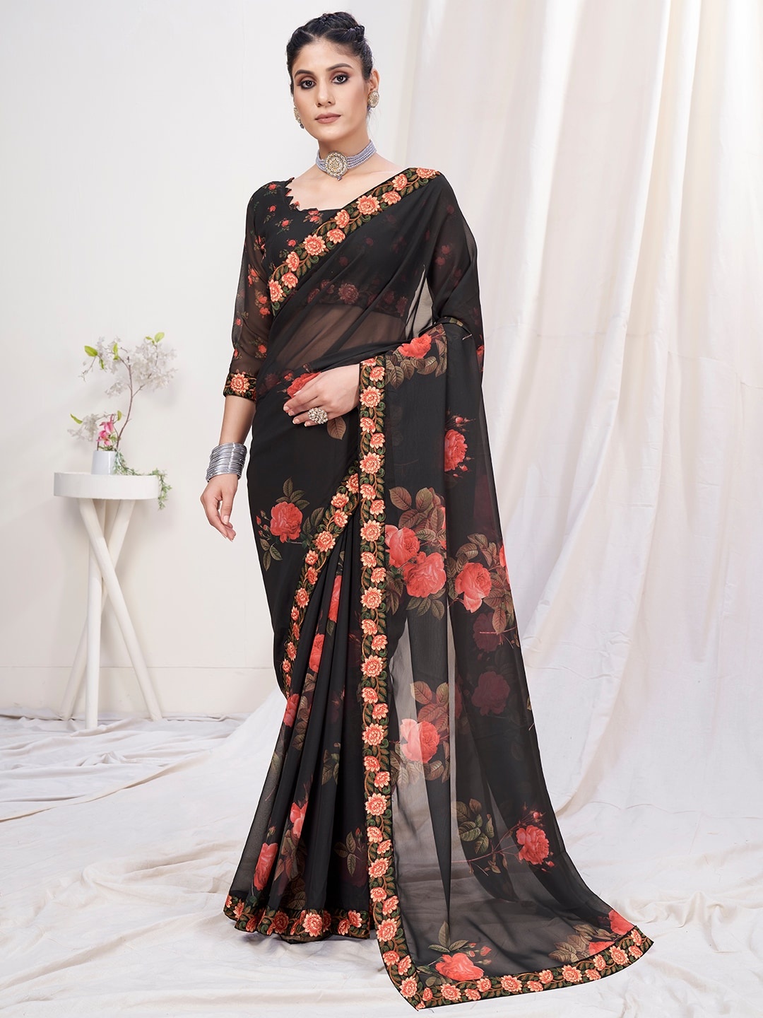 

Mitera Black & Orange Floral Poly Georgette Saree