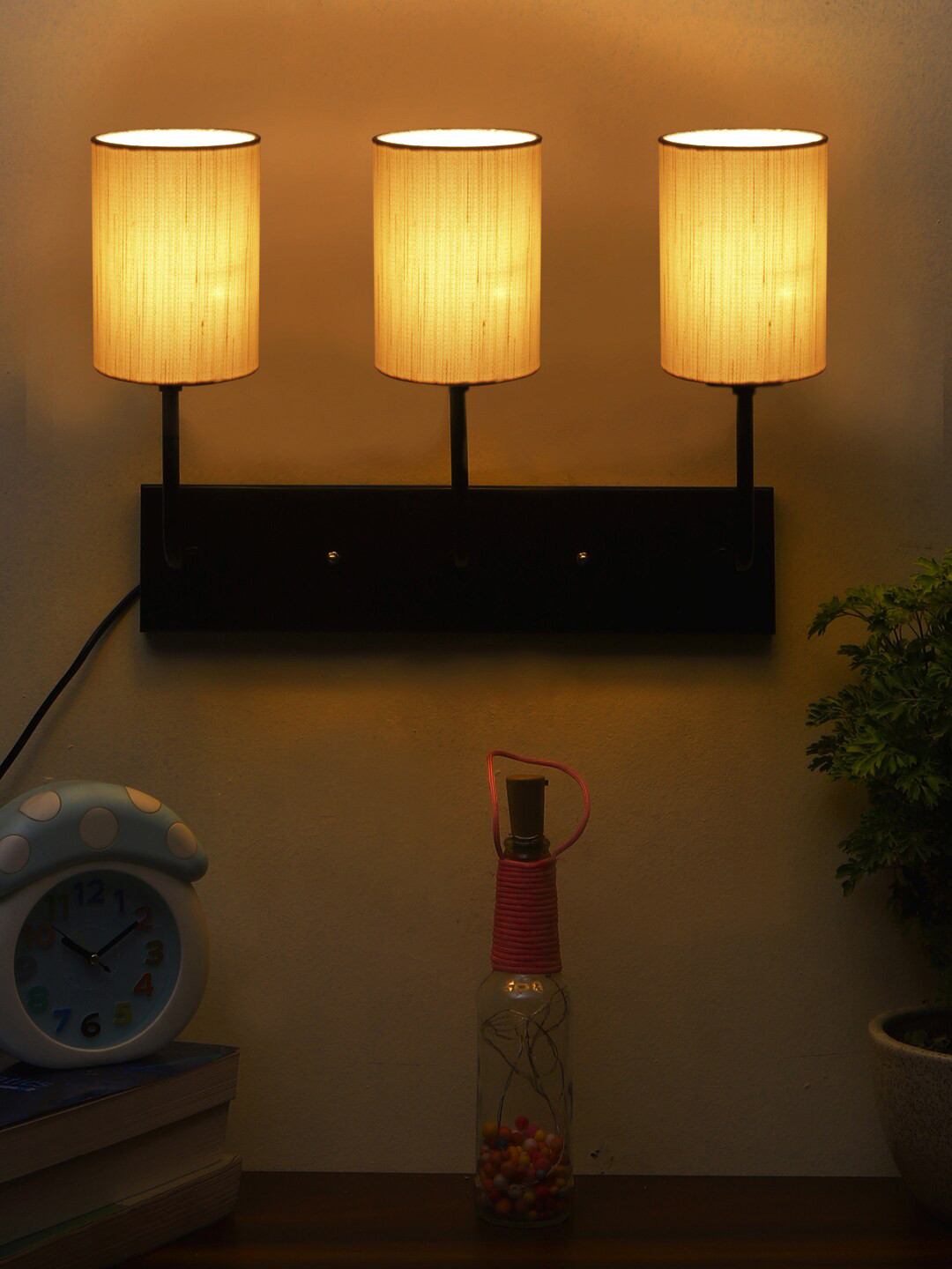 

Devansh Off-White Cylindrical Cotton Cluster Wall-Mounted Lamp