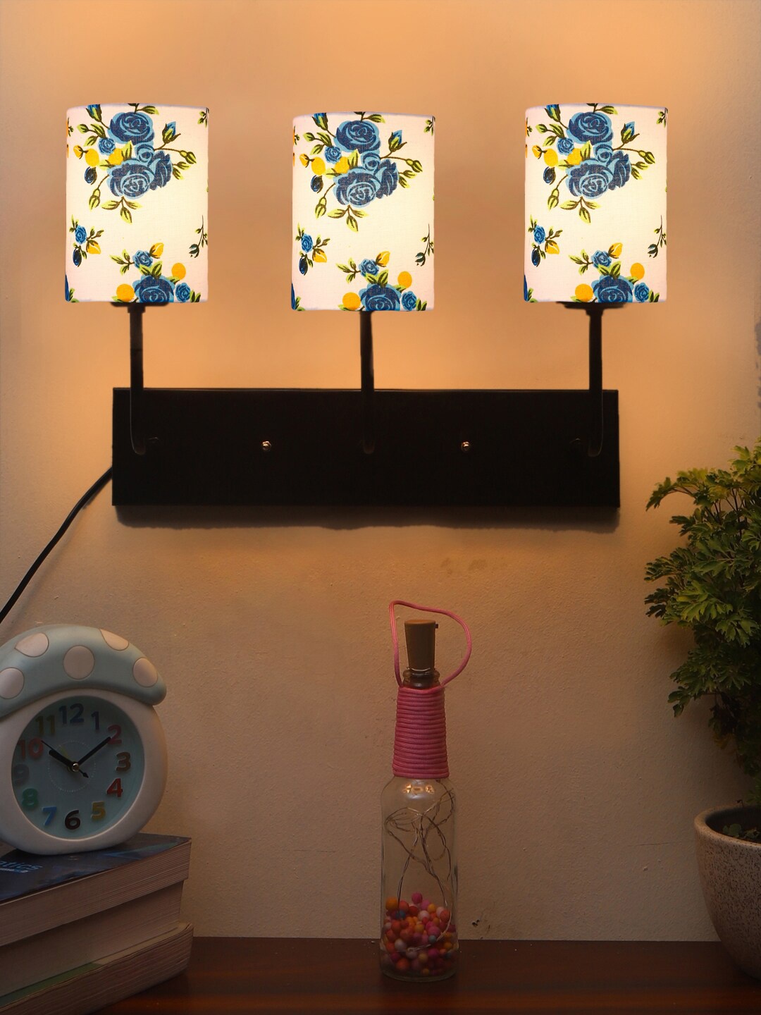 

Devansh White & Blue Floral Printed Cylindrical Cotton Cluster Wall-Mounted Lamp