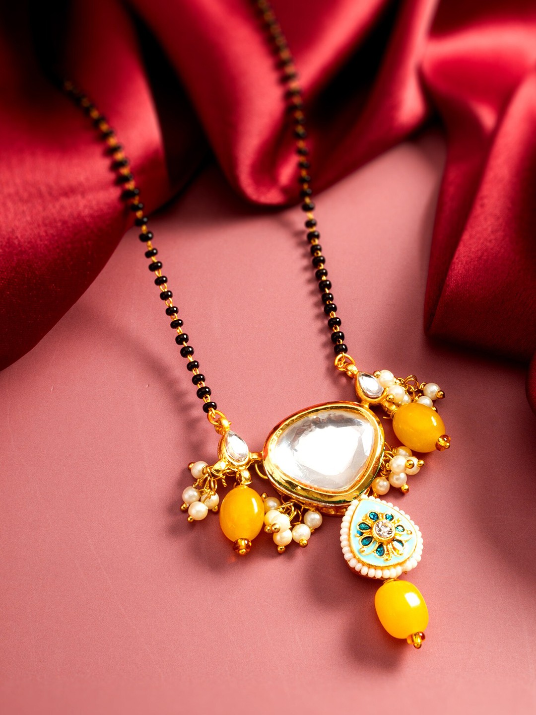 

aadita Gold Plated Floral Shaped Kundan Studded & Pearls Beaded Mangalsutra