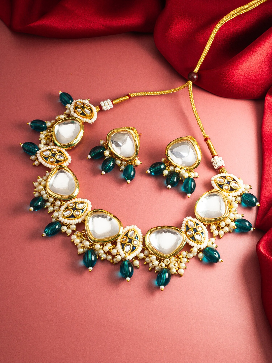 

aadita Gold-Plated Stone-Studded & Beaded Jewellery Set