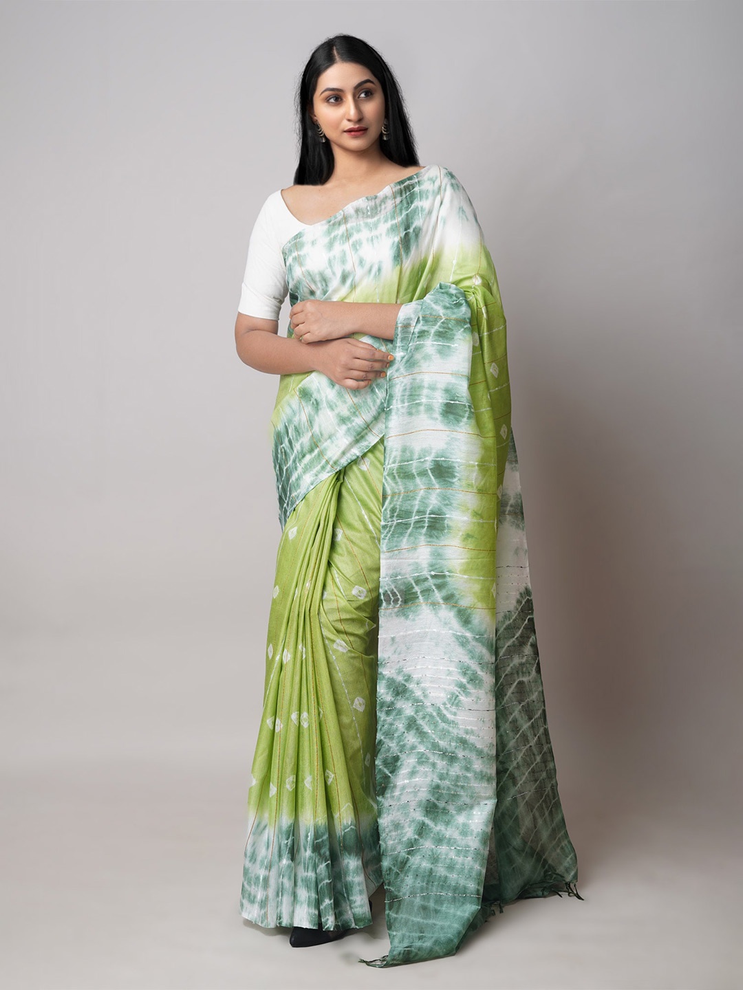 

Unnati Silks Green & White Tie and Dye Sequinned Silk Cotton Leheriya Saree